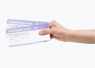 hand holding a airline boarding pass
