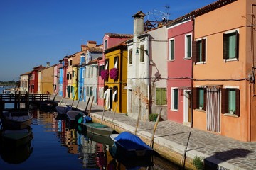 Fototapeta na wymiar Canal and sidewalk of Burano Island, Venice, Italy
