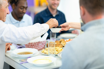 Fototapeta na wymiar modern multiethnic muslim family sharing a bowl of dates