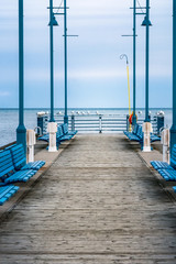 Dusk over an empty wooden pier, view out over the water