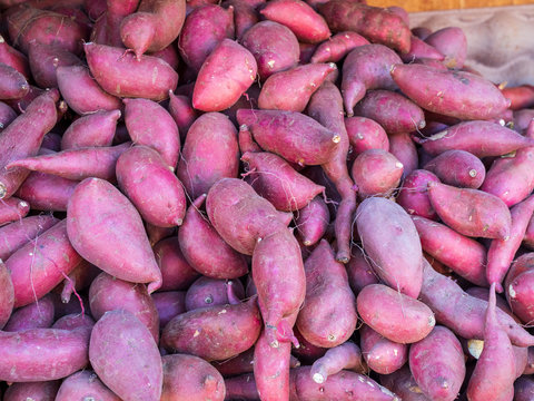 Pile of fresh yams at farmer market for sale