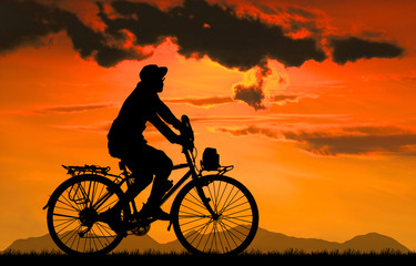 Fototapeta na wymiar Cycling Silhouette on sunrise background
