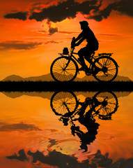Obraz premium Cycling Silhouette on sunrise background