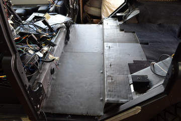 Tuning the car in a SUV body with three layers of noise insulation on the floor. Sound and vibration isolation using soft and pimply material with a car breakdown.