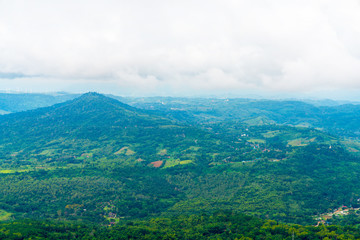 Fototapeta premium Blue sky high peak mountains fog hills mist scenery national park views at Phu Tub Berk, Khao Koh, Phetchabun Province, Thailand