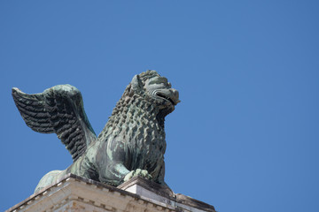 Bronze lion on a column in St. Mark's square. Venice. Italy.2019