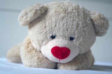 Depression concept Grief of children. The teddy bear sleeps sadly in the bed. It seems that people who are sad, disappointed.