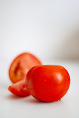 Tomatoes on a white background lay flat on the concept of food. 