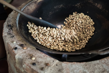 soft focus Traditional coffee beans roasting.Smoke in the coffee pan.