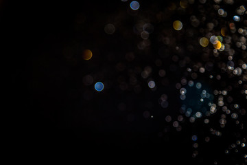 Colorful blur bokeh defocused on black