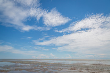 Fototapeta na wymiar Sand blue sky and clouds
