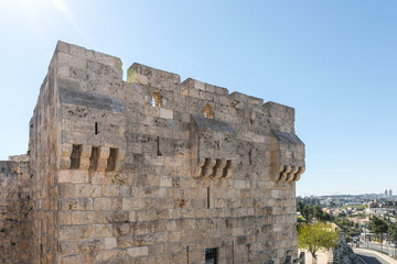 Fototapeta na wymiar Fragment of the city walls near the Jaffa Gate in old city of Jerusalem, Israel