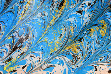 Beautiful abstract Ebru drawing technique .Turkish style of painting Ebru on water with acrylic paints twists the waves.A stylish combination of natural luxury