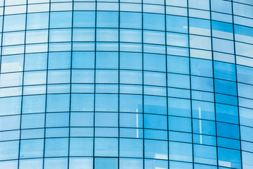Fototapeta premium Blue glass windows of office building