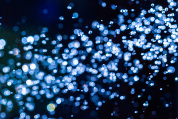 Abstract blue bokeh on black