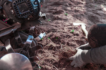 A person is working with gardening machinery