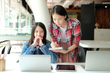 girl teenager studying with computer. college high school student taking note