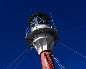 Top of a lighthouse with blue sky
