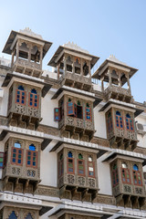 Fototapeta na wymiar Detail of architecture, decorated facade in Jaipur, Rajasthan, India