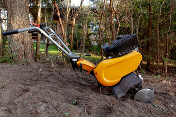 The right side of an aerator standing in a backyard