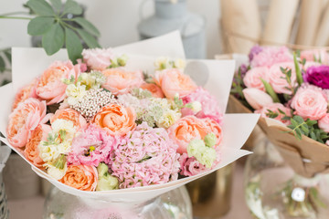 Obraz na płótnie Canvas showcase flower shop. Beautiful spring bouquets. Arrangement with mix flowers. Small family business. Work florist. copy space