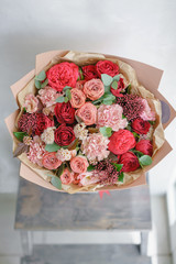 Small Beautiful bouquet of mixed flowers. Floral shop concept . Beautiful fresh cut bouquet. Flowers delivery