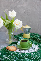 A tasty snack: a cup of coffee and a couple of cookies.