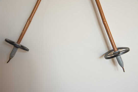 Old Classic Ski Kit Gear Hang On White Wall Background.