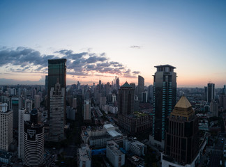 Fototapeta premium Aerial view of business area and cityscape in the dawn, West Nanjing Road, Jing` an district, Shanghai