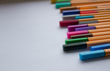 Fototapeta premium Set of colorful pens on white background