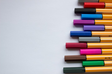 Set of colorful pens on white background