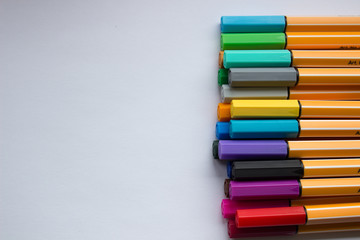 Set of colorful pens on white background