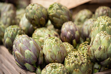 Obraz premium Artichokes. Vegetables market in Italy. Agricultural food. Fresh organic products.