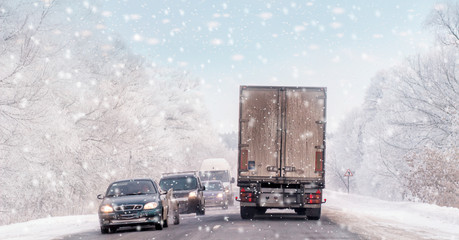 Driving in snow storm on bad winter Road