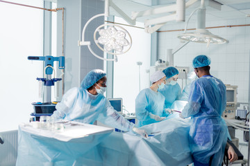 professional doctors improving person's appearance during surgery in the operating room.