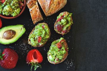 Toasts with guacamole. Avocado Strawberry Toast. Healthy diet snack. Keto toasts Keto diet.
