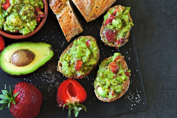 Toasts with guacamole. Avocado Strawberry Toast. Healthy diet snack. Keto toasts Keto diet.