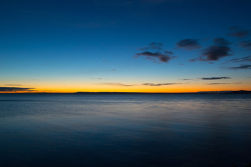 lake and sky with stars before sunrise