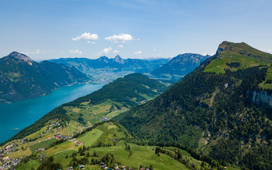 Naklejka na ściany i meble Panoramic aerial view of the lake Lucerne (Vierwaldstatersee), Rigi mountain and Swiss Alps in the background near famous Lucerne (Luzern) city, Switzerland - Immagine