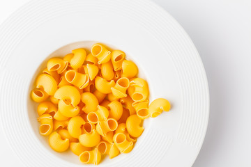 Pile of raw elbow Macaroni (Gomiti Pasta)