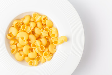 Pile of raw elbow Macaroni (Gomiti Pasta)