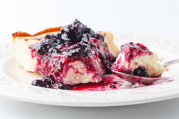 Cozy breakfast with a peace of berry cheesecake