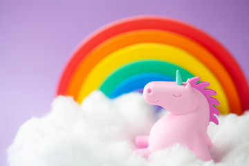 Happy Unicorn Sitting on a cloud