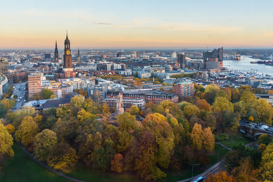 View of Hamburg with Michel, harbor, and New Elbphilharmony on sunset. Germany