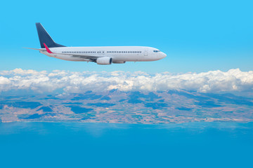 Passenger airplane in the clouds. travel by air transport