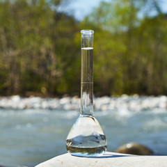 Glass flask with clean drinking water.