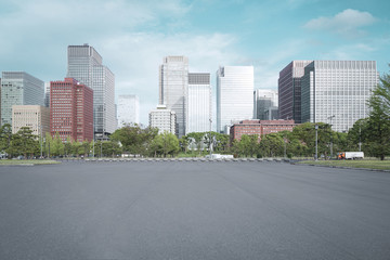 A group building with tree and road in a modern city in Tokyo. - Image