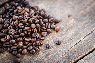Coffee cup and coffee beans on wooden background. Top view