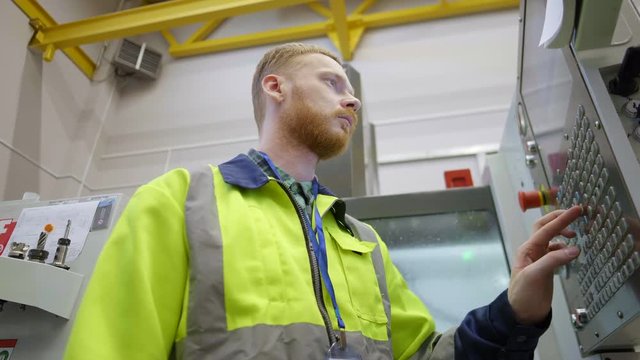 Engineer working with machine