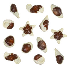 Figured chocolate sweets from white and dark chocolate isolated on white background